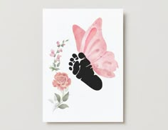 a greeting card with a pink butterfly and flowers on the bottom right hand corner, which has an image of a baby's foot