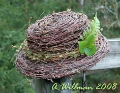 a close up of a bird nest on a fence