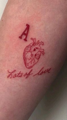 a tattoo with a heart and the letter a on it