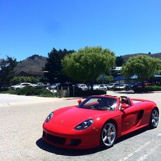 a red sports car parked in a parking lot