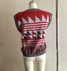 Rad 80s geometric sweater shirt/vest, maroon and gray colors. No tags but fits like a women's size small/medium. Shown here on a size 4 mannequin. Use measurements below for reference. A small discoloration spot (unnoticeable) shown in last photo. Measurements laying flat: 18.5 inches pit y 20.5 inches collar to hem Thanks for looking :) Fall Cotton Crew Neck Sweater Vest, Fall Cotton Stretch Sweater Vest, Retro Fall Layering Tops, Crew Neck Cotton Sweater Vest For Winter, Retro V-neck Fitted Vest, Fitted Cotton Crew Neck Vest, Casual Vest With Graphic Print For Fall, Fitted Cotton Sweater Vest For Layering, Fitted Cotton Sweater Vest For Winter