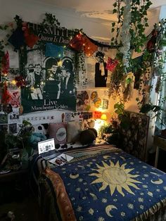 a bedroom with many plants and pictures on the wall