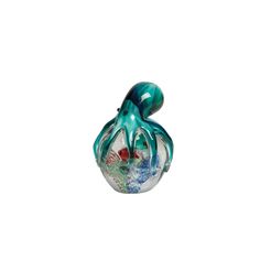 a glass figurine with an octopus on it's head