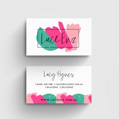 two business cards with pink and green paint strokes on the front, one in black and white