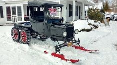 an old truck is parked in the snow