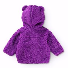 Purple fleece jacket for babies and toddlers. The jacket has a practical zip front and a hood with small teddy bear ears. The yoke construction at shoulders means comfort for movement and growth. This insulated piece can be used on its own or as an extra layer under outerwear on cold days. Take a look at the rest of our Molo Collection here Details: Fleece jacket in purple 100% Recycled Polyester from plastic bottles Gentle wash cold. Wash with similar colors, inside out. Close zippers before wash. Tumble dry, low. Do not iron. Do not bleach. Do not dry clean. This Molo product is made from 100% recycled polyester, produced from reused plastic bottles and other residual waste. The production of recycled polyester requires far fewer resources and emits less CO2. Teddy Bear Ears, Small Teddy Bear, Winter Sandals, Small Teddy Bears, Baby Sunglasses, Purple Fleece, Diaper Bag Accessories, Native Shoes, Bear Ears