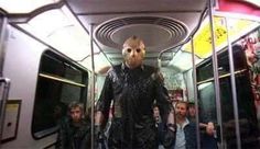 a group of people on a bus with a man wearing a mask