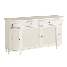 a white sideboard with two drawers and three doors