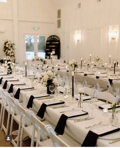 the tables are set with black and white linens