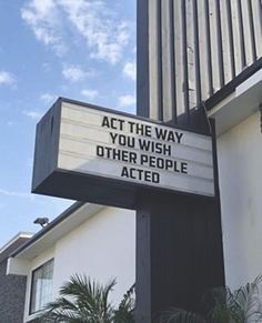 a sign that says act the way you wish other people ated on top of a building