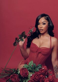 a woman in a red corset with roses