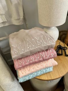 Hooray for all the Mama's out there!  We all have that one Mama we just could not do without, or maybe are are that Mama!   This Bella Canvas sweatshirt is the perfect go to for your closet, so soft and lightweight its the one you will reach for all year long!  Featured here for all our tone on tone lovers just like us, each color will is done in the perfect shade to match your favorite choice! What a great gift for yourself as a Mama, a new mama or shower gift for the mom-to-be! Features: 8 oz./yd² (US) 13.4 oz./L yd (CA) 52/48 Airlume combed and ring-spun cotton/polyester fleece, 32 singles Athletic Heather is 90/10 Airlume combed and ring-spun cotton/polyester fleece Pre-shrunk Retail fit Unisex sizing Ribbed cuffs and waistband Dropped shoulders Side seams Tear away label Embroidery is Sweatshirts For Moms, Mama Sweatshirt Ideas, Trendy Embroidered Sweatshirt, Neutral Sweatshirt, Mama Crewneck Sweatshirt, Mama Crewneck, Greenville Nc, New Mama, Mama Gifts