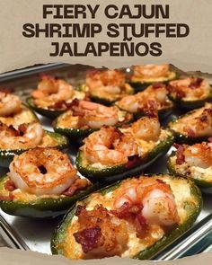 there are many stuffed jalapenos in the pan with shrimp and cheese on top