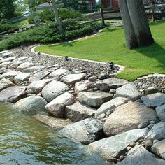 there is a small pond with rocks in it