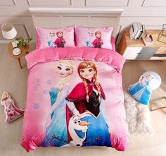 a bed with pink sheets and disney characters on it