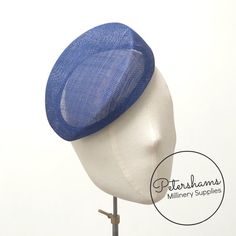 Betty is what we like to call a modern pillbox. Instead of having straight sides, this royal blue hat base has a gentle slope to one side and finishes off at a slight point. It looks great positioned at many angles and is finished on the inside with a petersham ribbon edge. Can be attached to the head with elastic, hair comb or headband (not included).Measurements:Width: 16.5x18.5cm (6.4x7.2 inches)Height at tallest ridge: 5.5cm (2.1 inches)We have hundreds of different hat bases available! To s Elegant Blue Sinamay Hat, Elastic Hair Comb, Ivory Pillbox Hat, Navy Blue Pillbox Hat, 60s Pillbox Hat, 30s Pillbox Hat, Sinamay Fascinator, Blank Hats, Millinery Supplies