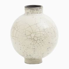 a white vase with cracky paint on the outside and black rim, against a white background