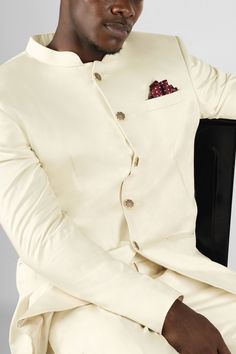 Step into elegance and style with our Merino Cream Bandhgala Premium Cotton Stretchable Blazer. This sophisticated ensemble combines traditional Indian aesthetics with contemporary fashion. Crafted from premium cotton, it offers a comfortable and breathable fit. The bandhgala, with its intricately designed mandarin collar and metallic button detailing, adds a touch of regal charm. Make a statement at any occasion with this truly unique and fashionable piece. In addition to being constructed from Jodhpuri Suit For Men, Jodhpuri Suits For Men, Jodhpuri Suit, Blazer For Men, Suit For Men, Suit Pant, Cotton Blazer, Long Blazer, Blazer And Shorts