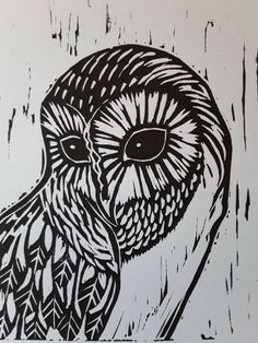 an owl is shown in black and white on a piece of paper with paint splattered over it