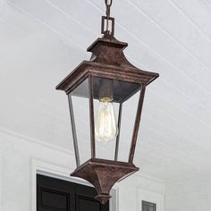 an outdoor light hanging from the ceiling