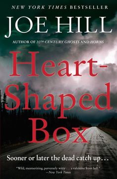 the cover of heart shaped box by joe hill, with an image of a road in the background