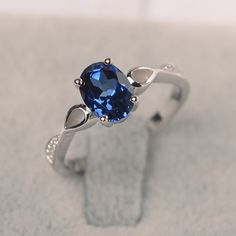 a blue ring sitting on top of a table