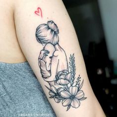 a woman's arm with a tattoo on it and a heart above her head