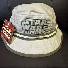 a star wars episode hat with a pin on it's front and back side