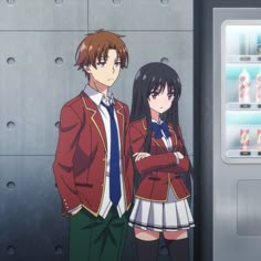 two anime characters standing next to each other