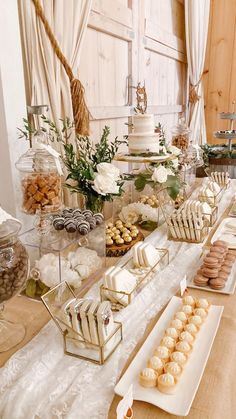 a table topped with lots of desserts and pastries