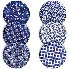 four plates with blue and white designs on them