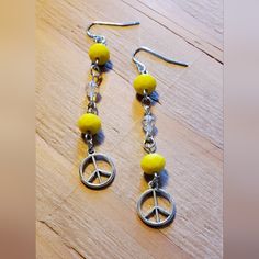 2¾ Inch Long Peace Sign Charm Earrings. These Cute Earrings Are Hand Crafted On Silver Tone Metal Findings With Yellow And Clear Beads Finished With Silvertone Metal Peace Sign. $10.00 +S&H #Countrygypsyor Peace Earrings, Clear Beads, Earrings Color, Peace Sign, Cute Earrings, Charm Earrings, 4 Inch, Silver Tone, Hand Crafted