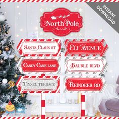 the north pole christmas sign is displayed in front of a christmas tree with presents on it