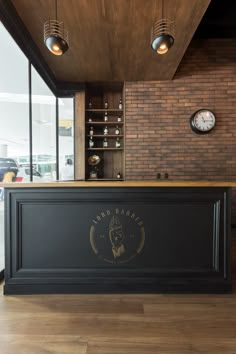 a bar with a clock on the wall behind it