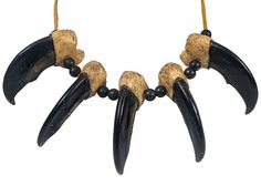 "These Realistic Claw Pendants look so real that they have even fooled conservation officers! The polar bear claws are made from quality plastic resin and are hand-painted in the USA. They come on a 32\" deerskin neck strap and have oxidized (antiqued) brass beads These necklaces are NOT Native-made. Genus and species(strap): Deer, Odocoileus virginianus. Wild. USA. Made in the USA by our staff We do not buy, sell, trade, or barter any products that are listed on the U.S. Endangered Species List Bear Claw Necklace, Deer Hide, Claw Necklace, Bear Claws, Deer Skin, Western Jewelry, Neck Strap, Brass Pendant, Fashion Jewelry Necklaces