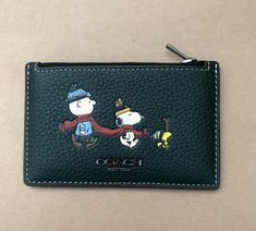 Product Details Refined pebble leather Five credit card slots Zip pocket 5" (L) x 3 1/4" (H) This special Coach x Peanuts collaboration combines our legacy of leathercraft with the playful attitude of the Peanuts crew Snoopy Items, Snoopy Pictures, The Peanuts, Cute Wallets, Snoopy Love, Our Legacy, Cute Little Things, Bits And Bobs, Leather Craft