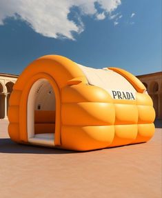 an inflatable tent with the word prada written on it is sitting outside