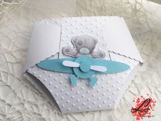 a close up of a greeting card with a teddy bear on the front and bottom