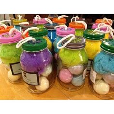 there are many jars with different colored balls in them