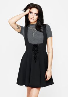 It’s a cinch - Black lace-up mini-length pinafore dress  - Flattering fit ‘n’ flare with an A-line skirt  - Underbust neckline, squared back & sleeveless finish is perfect for layering with tees, crops, or mesh  - Lace-up feature on front secured by velour ribbon threaded through eyelets   - Two handy side pockets Underbust Dress, Fit Foundation, Alt Style, Elegant Office, Sleeveless Short Dress, Wrap Shirt, Swimwear Dress, Pinafore Dress, Striped Crop Top