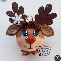 a christmas ornament with reindeer's head and antlers on it