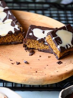 chocolate and marshmallow squares on a wooden plate