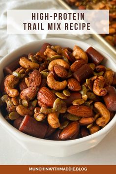 a white bowl filled with mixed nuts