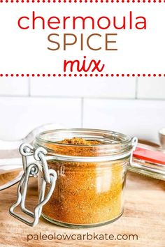 a jar filled with spices sitting on top of a wooden table