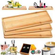 three wooden trays with candles, perfume bottles and jewelry on them next to each other