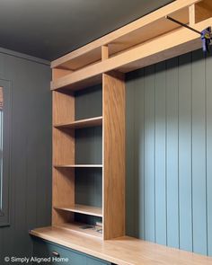 an empty room with some shelves and cupboards