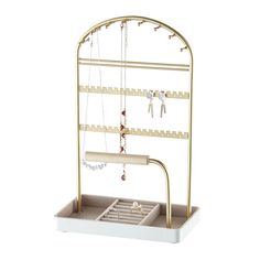 a jewelry rack with two necklaces hanging from it's sides and an open drawer underneath