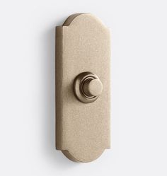 an image of a door handle on a white wall with a circular knob in the middle