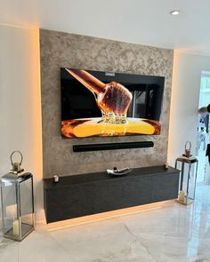 a large flat screen tv mounted to the side of a wall