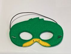 "Mallard Duck Masks. Great for dramatic play/dress-up. Fun mask for Halloween or Cos Play. These masks would make a fun party favor or fun addition to a themed birthday party. Need a larger quantity than what I have listed? Message me. I can usually accommodate larger orders. These masks are made from felt. The details are machine embroidered. The masks include a 13\" elastic strap. This size typically fits from age 3 to small adult. This mask measures approximately 7 by 4 inches. These items ca Themed Green Costume For Costume Party, Themed Carnival Masks, Themed Mask For Carnival Costume Party, Themed Masks For Costume Party And Carnival, Themed Mask For Costume Party And Carnival, Themed Masks For Halloween Costume Party, Themed Masks And Prosthetics For Cosplay, Novelty Costume Accessories For Mardi Gras, Mardi Gras Novelty Costume Accessories For Costume Party